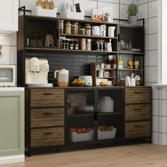 a kitchen with lots of cupboards and shelves filled with food on top of wooden floors