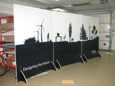 three black and white panels with the words designing the future written on them next to bicycles