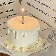 a birthday cake with a single candle on it