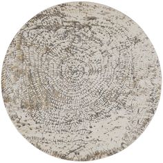 a round rug with an intricate design on the top and bottom, in grey tones