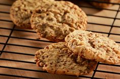 three cookies cooling on a wire rack