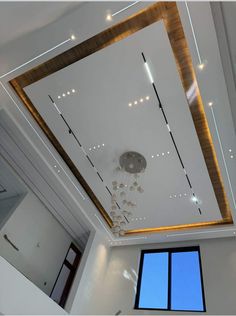 the ceiling in this room is decorated with lights