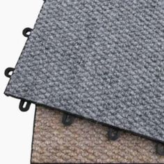 two carpet mats on top of each other in different colors and sizes, with black handles