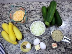 ingredients to make zucchini sitting on a counter top