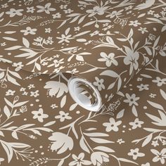 a brown and white floral wallpaper with flowers on the side, it is very nice to use