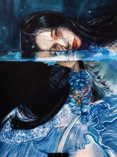 a drawing of a woman with long black hair and blue dress in water, next to an image of the same woman's face