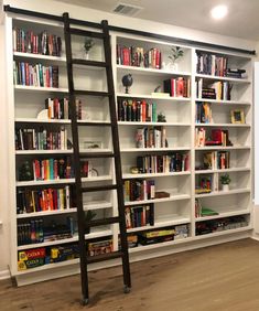 a ladder leaning up against a bookshelf filled with books