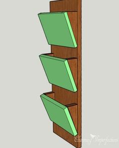 a wooden book shelf with three green boxes on the bottom and one in the middle