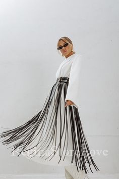 Step into the world of bohemian chic with our stunning Belt with Fringe. This fashion-forward accessory is the perfect addition to elevate your dress, accentuate your waist, and make a bold fashion statement. Crafted with care and attention to detail, this fringe belt exudes a sense of effortless style and adds a touch of flair to any outfit. Choose from an array of captivating colors to match your personal style and wardrobe. From classic black and timeless brown to vibrant red, feminine pink, Blue Fringe Belt, Fringe Skirt Outfit, Dress Festival Outfit, Rave Outfits Women, Skirt Fringe, Belt For Dress, Fringe Belt, Skirt With Fringe, Fringe Clothing