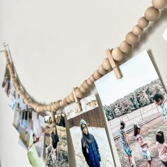 several photos hanging on a string with clothes pins