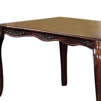 a wooden table with an ornate design on the top