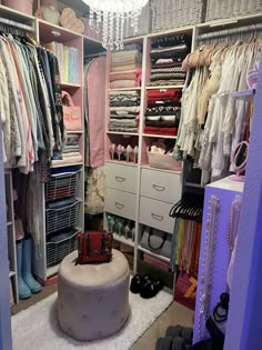 an organized closet with clothes, shoes and other items in it's storage area