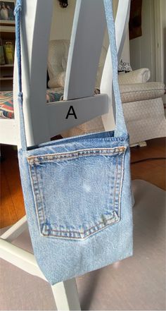 a chair made out of an old pair of jeans with the letter a in it