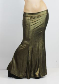 GOLD VINTAGE MERMAID SKIRT This gorgerous metallic mermaid skirt is available in old gold and dark silver colors, perfect to level up any look with this metallic efect. The beautiful mermaid shape makes every body type look gorgerous and stylized. Perfect for several looks, night outfits, stage and performances, or a more casual extravagant look, your choice! Super elastic and incredibly confortable, it adapts perfectly to all your movements. Long strech mermaid skirt. They can be machine washed Gold Lined Skirt For Night Out, Metallic Lined Flared Skirt, Glamorous Stretch Gold Bottoms, Fitted Glamorous Gold Skirt, Glamorous Gold Stretch Bottoms, Elegant Metallic Long Skirt, Elegant Lined Gold Skirt, Elegant Gold Fitted Bottoms, Metallic Skirt For Evening