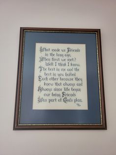 a framed cross stitch poem hanging on the wall