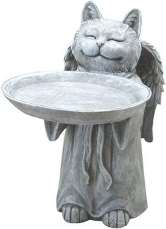 a cat statue holding a tray with wings on it's back and eyes closed