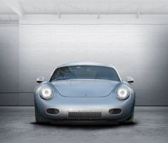 a silver sports car parked in a garage