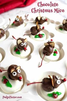 chocolate christmas mice are sitting on top of each other in the middle of a white plate