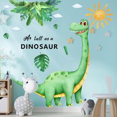 a child's bedroom with a dinosaur wall decal and other children's toys