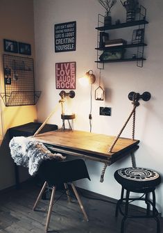 a wooden table sitting next to a black chair