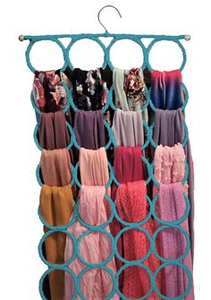 a rack that has many different colored pants hanging from it's sides and the bottom section