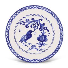 a blue and white plate with two birds in the center, on a white background