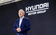 a man standing in front of a sign with the words hyndal motor group on it