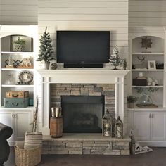 a living room filled with furniture and a flat screen tv on top of a fireplace