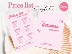 two pink price lists sitting on top of a plate