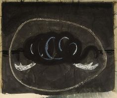 a drawing of a black object with white writing on it