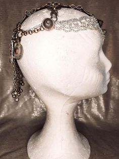 Stunning vintage old gold and super sparkling rhinestones headdress. This headpiece has a central piece all covered in strass and sparkling white rhinestones combined with antique afgan pieces that gives the whole piece an awesome movement and elegant look. On the back, a flower shaped rhinestones, and an old kuchi piece will make your look the most incredible and sparkling in the room. One of my favorites, makes anyone look like an incredible vedette from the 20'. One of a kind, our headpieces Adjustable Festival Headpiece With Rhinestones, Adjustable Rhinestone Festival Headpiece, Adjustable Rhinestone Headpiece For Festival, Adjustable Crystal Crown Headpiece, Silver Rhinestone Crown Headpiece, Adjustable Silver Rhinestone Headpieces, Bohemian Round Crown Headband For Party, Bohemian Headband With Round Crown For Party, Bohemian Party Headband With Round Crown