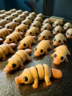 some very cute little toy animals in the shape of caterpillars