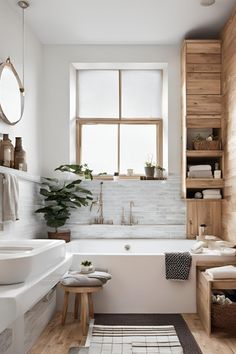 a bathroom with a tub, sink and toilet next to a wooden shelf filled with towels