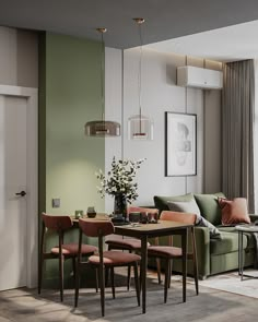 a living room filled with furniture and a dining table next to a window on top of a hard wood floor