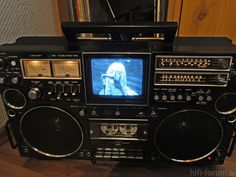 an old fashioned radio with a woman on the screen