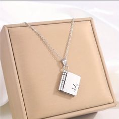 Really Nice, Simple, Fashionable Stainless Steel Heart Shaped Open And Close Book Charm Necklace. Perfect For Couples And Best Friends, Or That Special Someone! 18 Inch Chain. Book Charm, Book Pendant, Womens Jewelry Necklace, Charm Necklace, Really Cool Stuff, Heart Shapes, Best Friends, Jewelry Necklaces, Women Jewelry