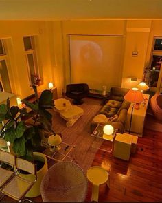 an overhead view of a living room with couches, chairs and tables in it