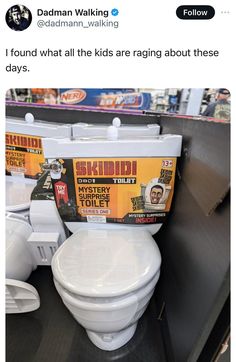 a white toilet sitting inside of a store