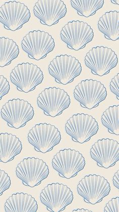 blue scallop shells on a beige background with white outlines in the middle