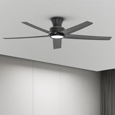 a ceiling fan in an empty room