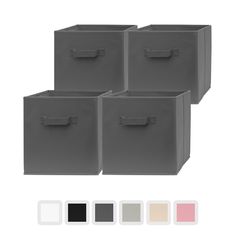 four small storage bins with handles in various colors and sizes, including black, white, gray, pink, green