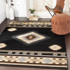 a black and tan area rug in a living room