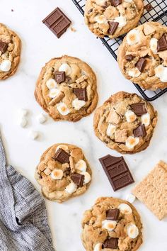 chocolate chip cookies with marshmallows and graham crackers on a cooling rack