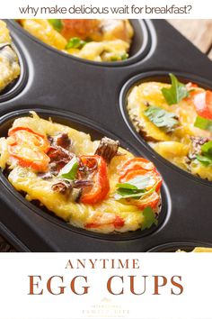 an egg cup filled with different types of food in muffin tins on top of a wooden table