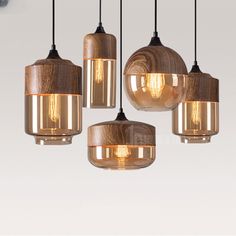 five light fixtures hanging from a ceiling