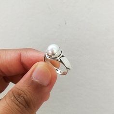 Important : PLEASE ENTER YOUR PHONE NUMBER IN THE "NOTE TO SELLER" SECTION DURING CHECKOUT, SO THAT THE DELIVERY CAN BE HASSLE FREE.Material: Solid Sterling silver Stone: pearl stone size: varies( According to the ring sizes)ships worldwide from India925 stampedHandmade itemOur products are totally handmade and made with high quality gemstones and 925 solid sterling silver.If you believe in buying top quality products for yourself and for your family and friends, SilverDynasty is the place where Silver Sterling Pearl Ring, White Gold Pearl Ring In Sterling Silver, Sterling Silver Open Pearl Ring With Polished Finish, White Gold Sterling Silver Open Pearl Ring, Silver Pearl Promise Ring With Round Band, Sterling Silver Pearl Ring For Anniversary, Anniversary Sterling Silver Pearl Ring With Round Band, Sterling Silver Pearl Promise Ring, Sterling Silver Pearl Promise Ring With Round Band