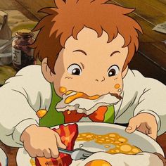 a young boy eating breakfast from a bowl