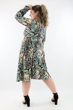 Flower Child Midi Dress with pockets features pastel coloured flowers in green, orange and yellow, printed across a black background. Finished with a stunning full length bell sleeve, invisible pockets, subtle empire waist and a v-neck line. NEW SIZING Range: Midi Length DressStyle: Full Length Bell Sleeve - V-neck - A-line dress Size Recommendation: If in between sizes, size down for a firmer fit, size up for a looser fit. Made with curves in mind Sizes 6-28 Two side pockets V-neckline Suitable Dresses For Winter, Patterned Dresses, Curvy Body Types, Midi Dress With Pockets, Peasant Sleeve, Fleece Leggings, Leggings Casual, Orange And Yellow, Fleece Joggers