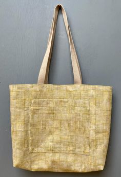 Hand-sewn open-top canvas tote bag with cotton interior lining. - Fabric: Cotton/linen canvas exterior, 100% cotton interior  - Handles: 100% cotton webbing, 27" total length for each strap, 1" wide - Pockets: Two interior 9"x9" pockets, one 7"x9" exterior pocket Machine washable. Based on the Pepin Tote pattern by Anna Graham/Noodlehead Patterns Rectangular Canvas Shoulder Bag With Flat Pocket, Daily Use Canvas Tote Bag With Flat Pocket, Everyday Rectangular Canvas Bag With Laptop Sleeve, Canvas Tote Shopping Bag, Fabric Tote Bag For Everyday Use, Everyday Fabric Tote Canvas Bag, Everyday Tote Canvas Bag, Everyday Fabric Tote Bag, Square Canvas Bag For Daily Use