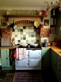 an old fashioned stove and oven in a kitchen